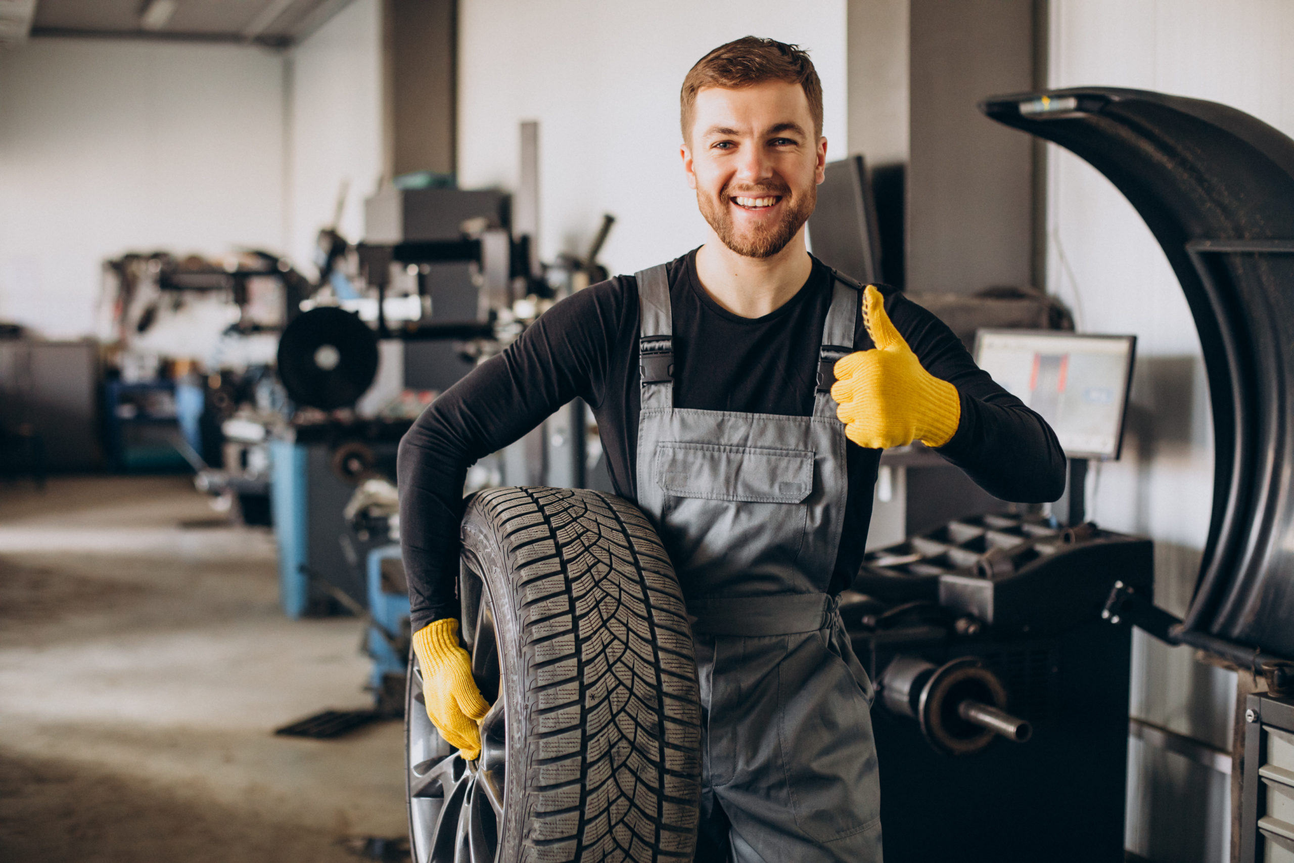 Car mechanic changing a car's wheels