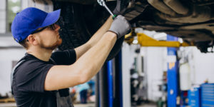 Mechanic servicing a car in the workshop