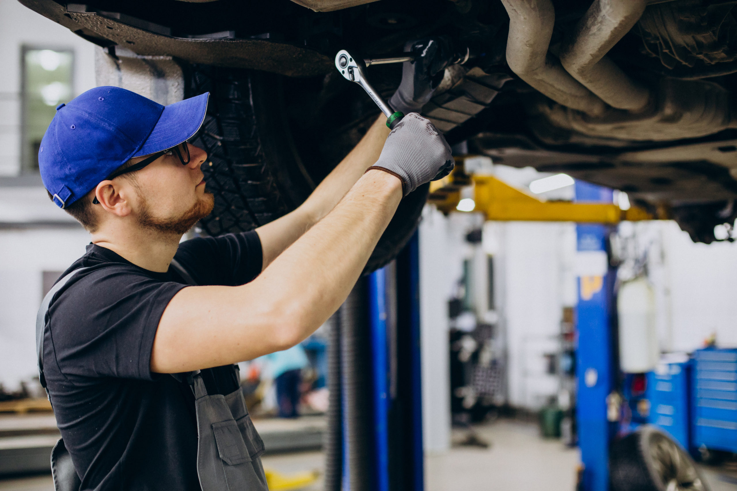 Mechanic servicing a car in the workshop